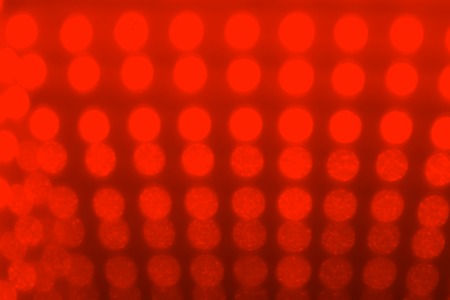 Multicolored defocused bokeh lights background. illuminated tableの写真素材