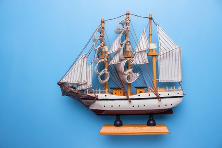 ship model on blue bacground. close upの写真素材