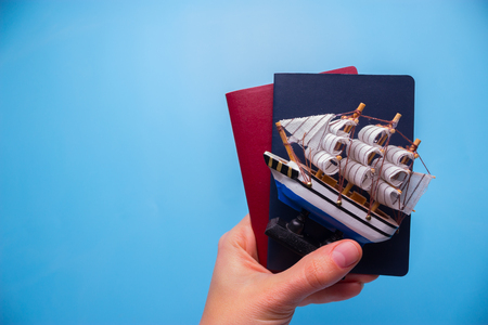 passport on blue background. travel abroad conceptの写真素材