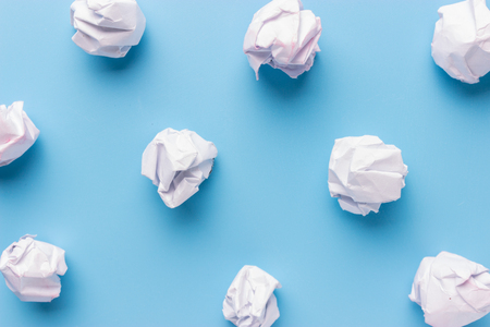 crumpled paper on white table brainstorming in the office conceptの写真素材