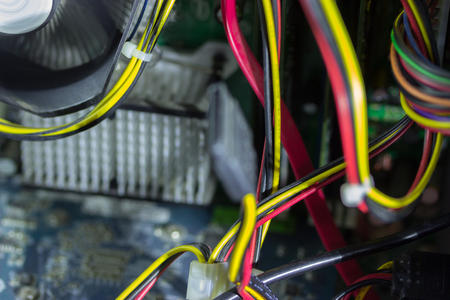 Printed Circuit Board with many electrical components and cabelsの写真素材