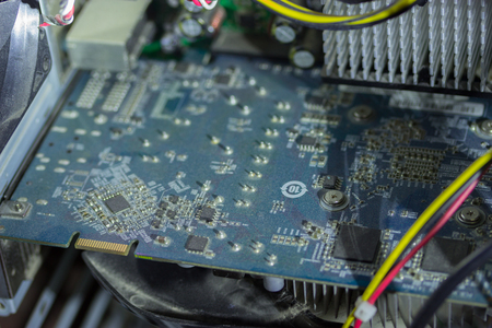 Printed Circuit Board with many electrical components and cabelsの写真素材