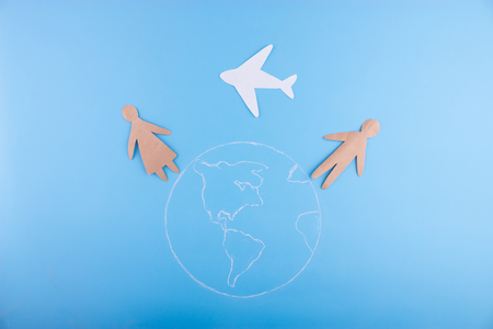 paper couple in love miss each other. plane between themの写真素材