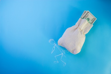 sketch of a Businessman carrying bag of dollarsの写真素材