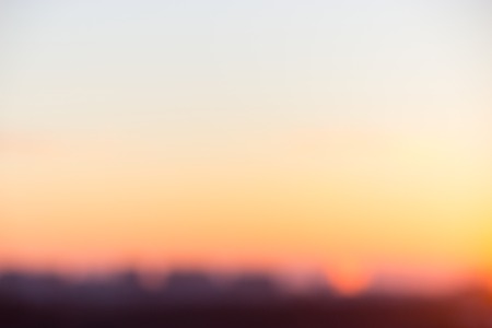 Yellow background concept: Sun light with blur beautiful nature autumn sunrise.