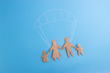 Social protection concept. family on the parachuteの写真素材