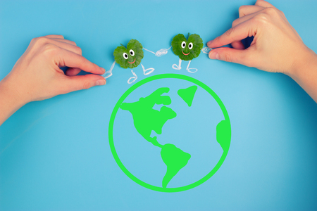leaf character holding hans with people. environmental concept