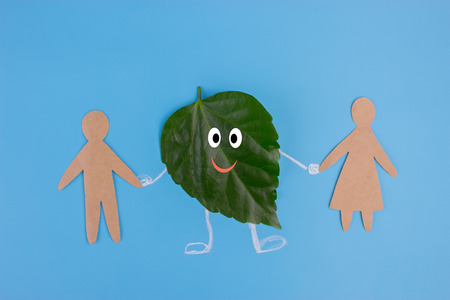 leaf character holding hans with people. environmental conceptの写真素材