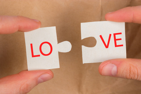 closeup of two pieces of a puzzle. love conceptの写真素材