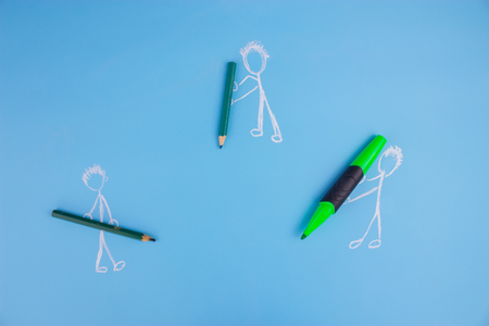 drawing character with green marker. copy space