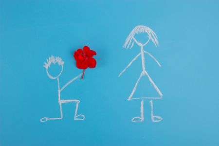 making proposal concept. man and woman on blue backgroundの写真素材