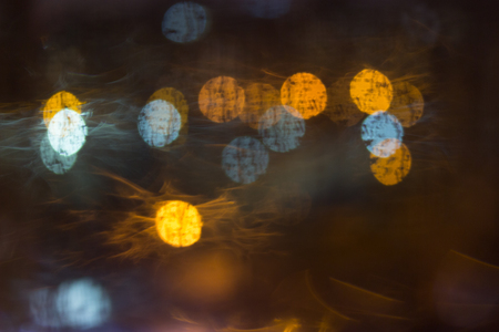 Drops of rain on window, night. blurred lightの写真素材