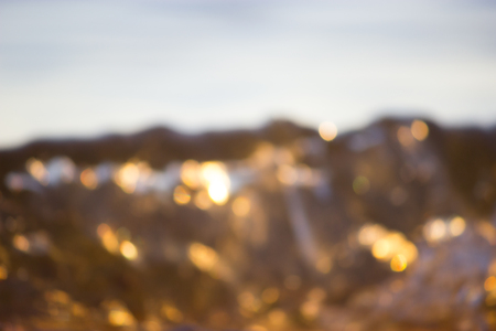 Sea ,sun ,beach. blurred waves bokeh backgroundの写真素材