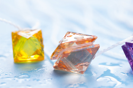 colorful jewellery on the blue background.の写真素材