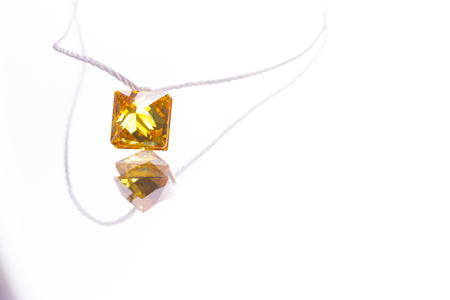 colorful glass pendants on light background.の写真素材