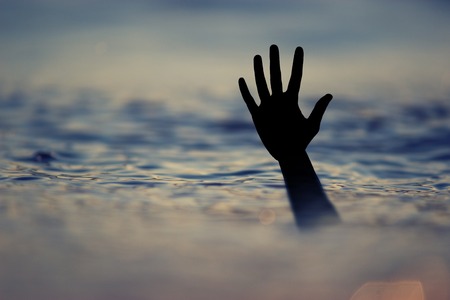 Drowning victims, Hand of drowning man needing help.の写真素材