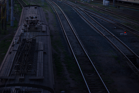 Railway Tracks at a Major Train Station at night. low key
