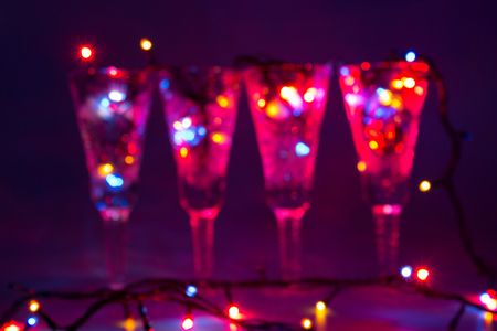 wineglasses and colorful garland.の写真素材