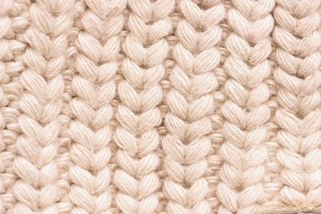 Close-up of knitted wool sweater. grey colour