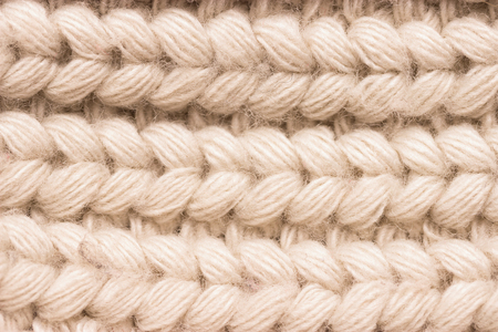 Close-up of knitted wool sweater. grey colour