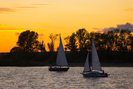 Luxury yachts at Sailing regatta. Sailing in the wind through the waves at the Sea.の写真素材