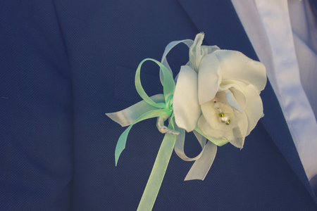 Groom with blue suit and white tie close upの写真素材