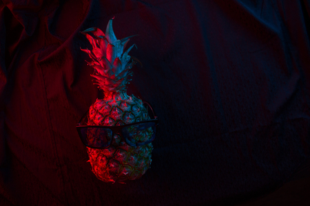 pineapple wearing sunglasses. summer night club conceptの写真素材