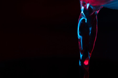 Red and blue neon background from water flow. defocusedの写真素材