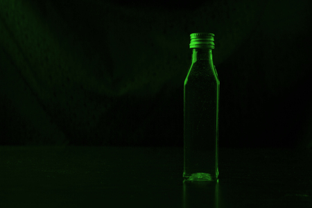 The poison is a green liquid in a bottleの写真素材