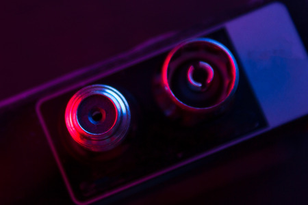 close up of some electronic stuff in neon lightの写真素材