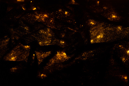 lights background image. blurred lights under black material