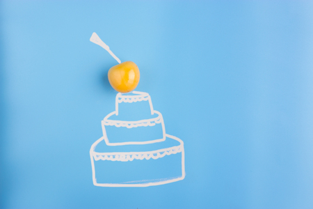 cake on blue background. cherry on the topの写真素材