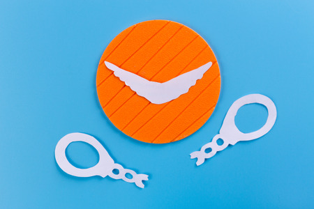 silhouette of broken handcuff made from paper. freedom concept