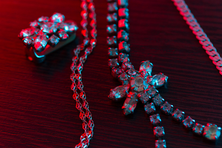 jewellery on dark background in neon lightの写真素材