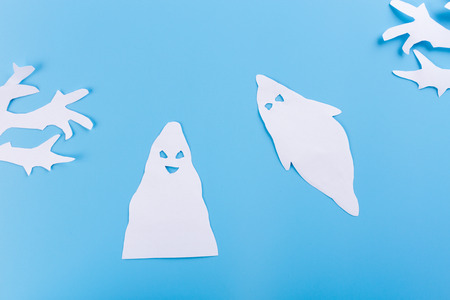 A scary ghost shadow flying. made of paperの写真素材