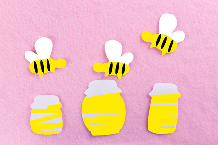 honey in jar and bees. made of paperの写真素材