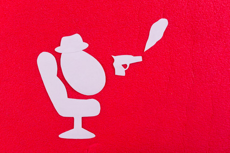mafia concept image. gun and hat on red backgroundの写真素材