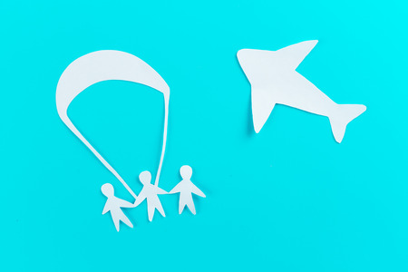 Skydiver freedom concept. paper person and parachute