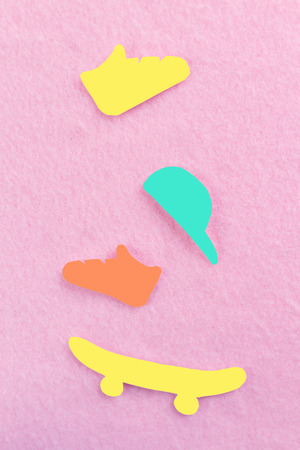 skateboard made of paper on pink background