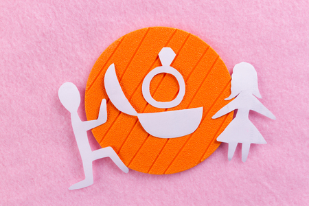 proposal concept image. man and woman. pink backgroundの写真素材