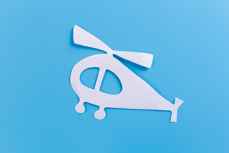 Helicopter in flight on blue background. paper cutの写真素材