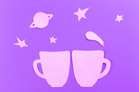 cup on starry sky background made of paperの写真素材