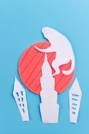 big monkey on skyscraper made of paperの写真素材