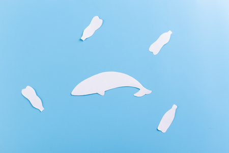 ocean plastic pollution issue. plastic bottles and fishesの写真素材