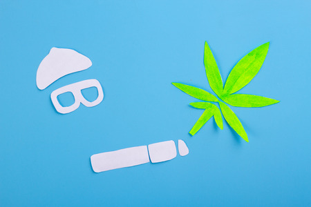 marijuana on blue background. smoke marijuana conceptの写真素材