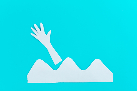 Drowning hand in stormy sea asking for help. cartoonの写真素材