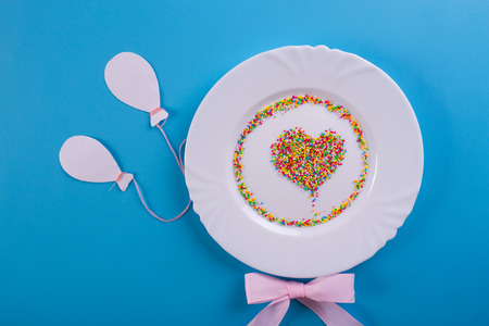 Birthday party background. plate on blue backgroundの写真素材