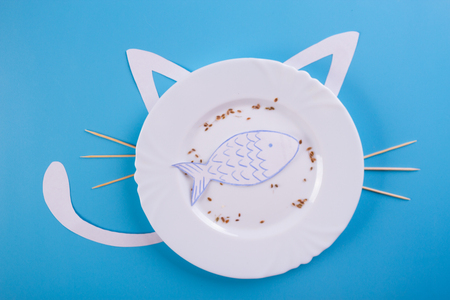 cute hungry cat character on blue backgroundの写真素材