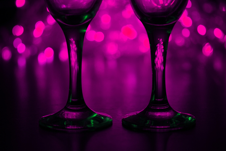 Wineglasses on blurred background. romantic conceptの写真素材