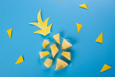 pineapple slices on the blue background. summer fruitsの写真素材